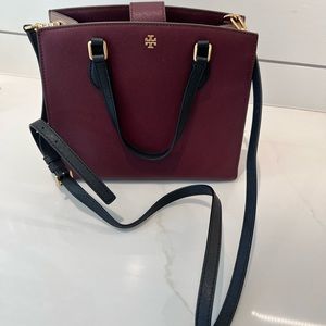 Tory Burch burgundy bag with black handles and strap